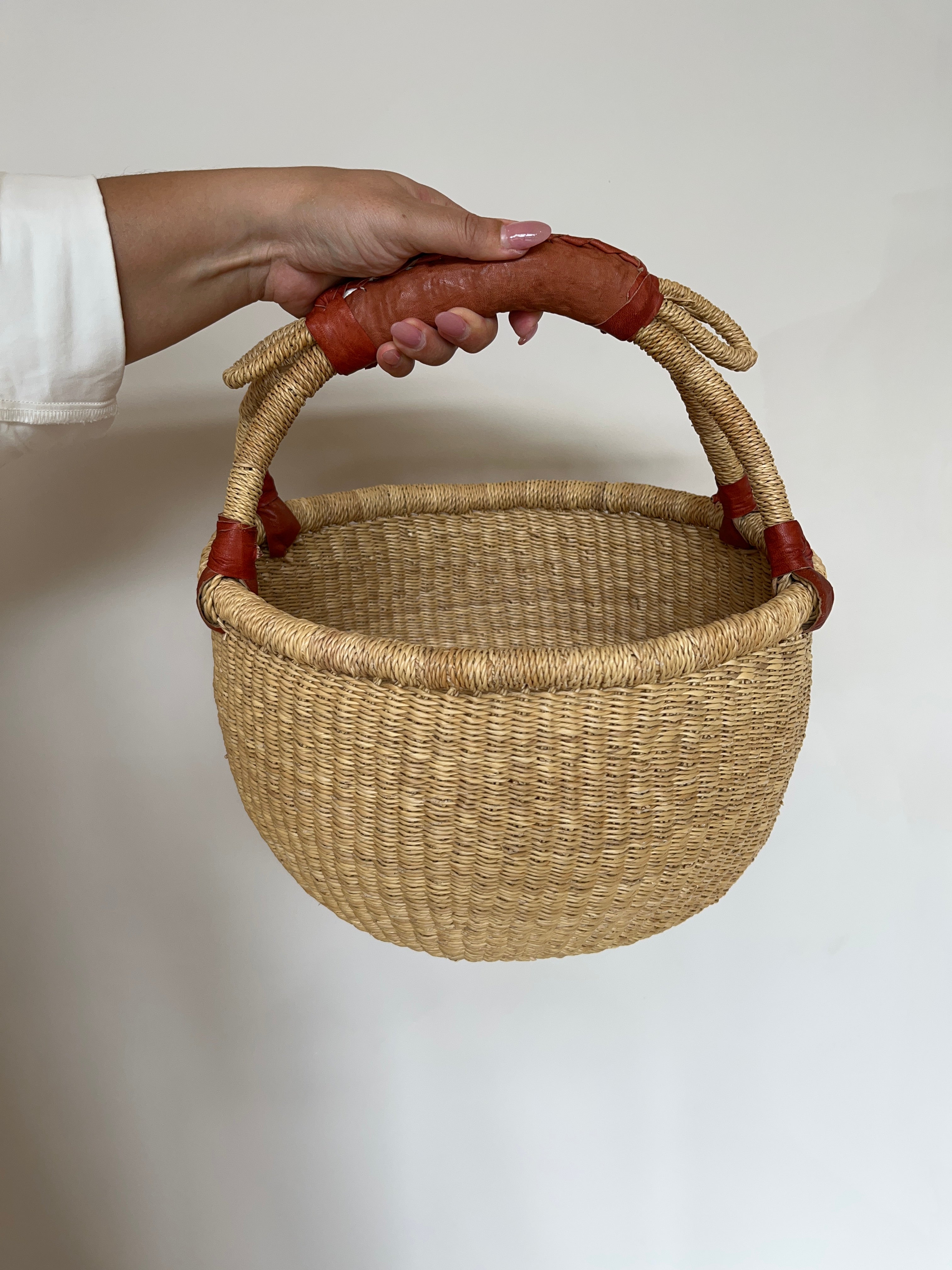 Medium basket held in hand